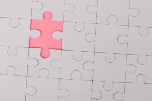 White puzzle with pink background
